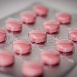 A blister pack of pink pills representing Benadryl allergy medicine