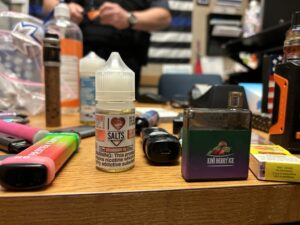 A display of just some of the vaping products confiscated from students at Skyview High in Billings, Montana. Officials said there were more products that were taken, but they were introduced as evidence in a court after ticketing students for minor in possession. (Photo by Darrell Ehrlick of the Daily Montanan)