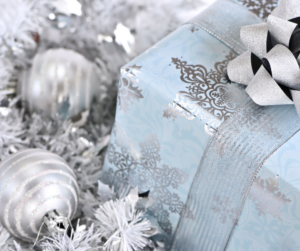 Light blue wrapped gift box with silver ornaments.