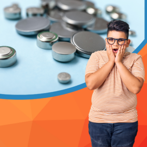 Image of button batteries of all sizes on a blue table with a startled teenager looking at them