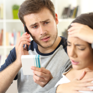Photo of a person calling a medical provider on the phone because a loved one is experiencing a side effect after using an over-the-counter medicine. Photo credit: Antonioguillem | Adobe Stock