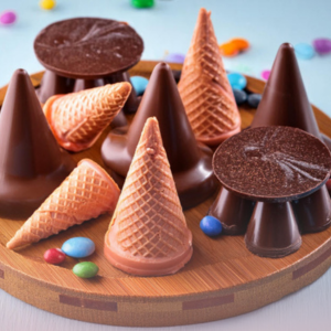 Pieces of Chocolate candy shaped as ice cream cones.