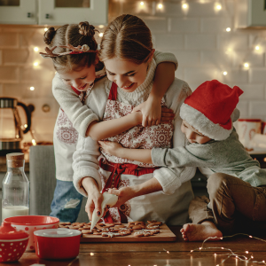 Mother and kids baking holiday cookies.together