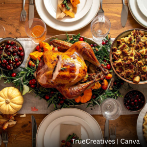 Dinner table decorated with fall decor and holiday foods.