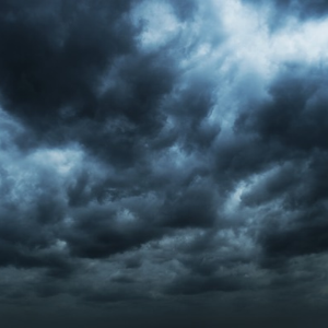 Dark storm clouds gathering in an overcast sky.